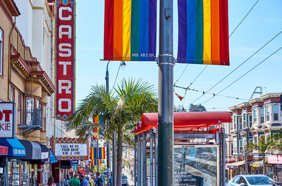 castro sign with rainbow flags