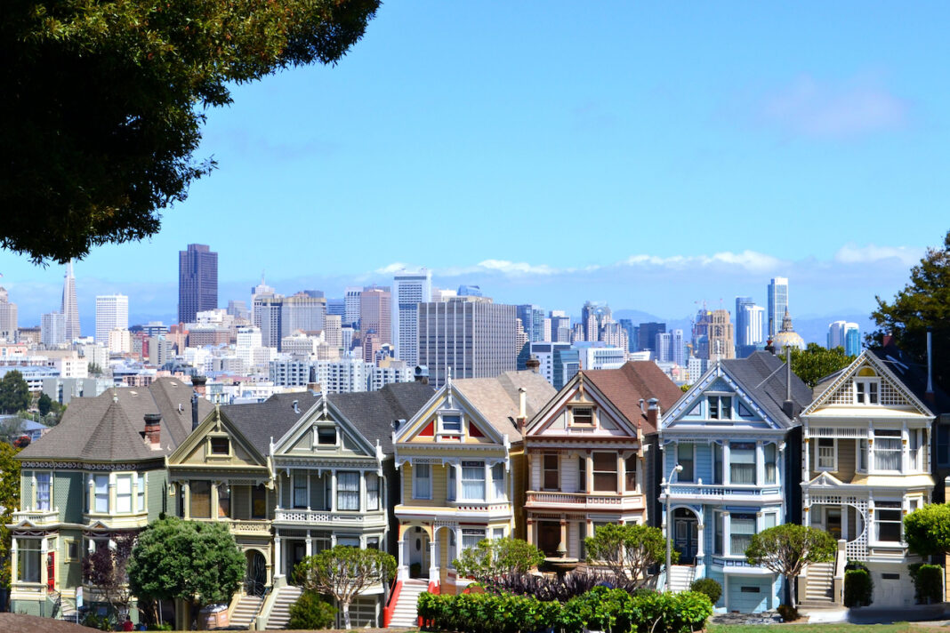 sf apartments with city skyline in background