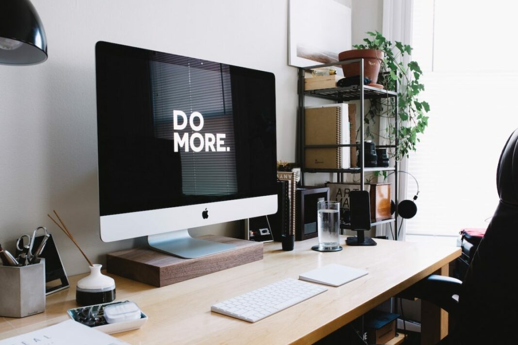 home office with an apple computer reading do more