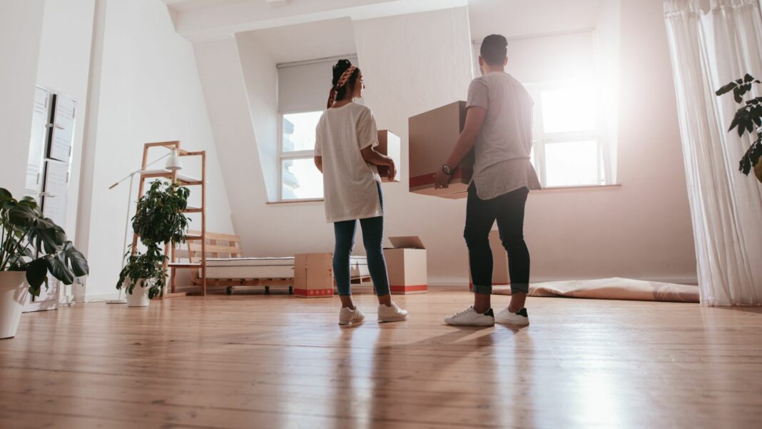 Couple moving into an apartment with boxes