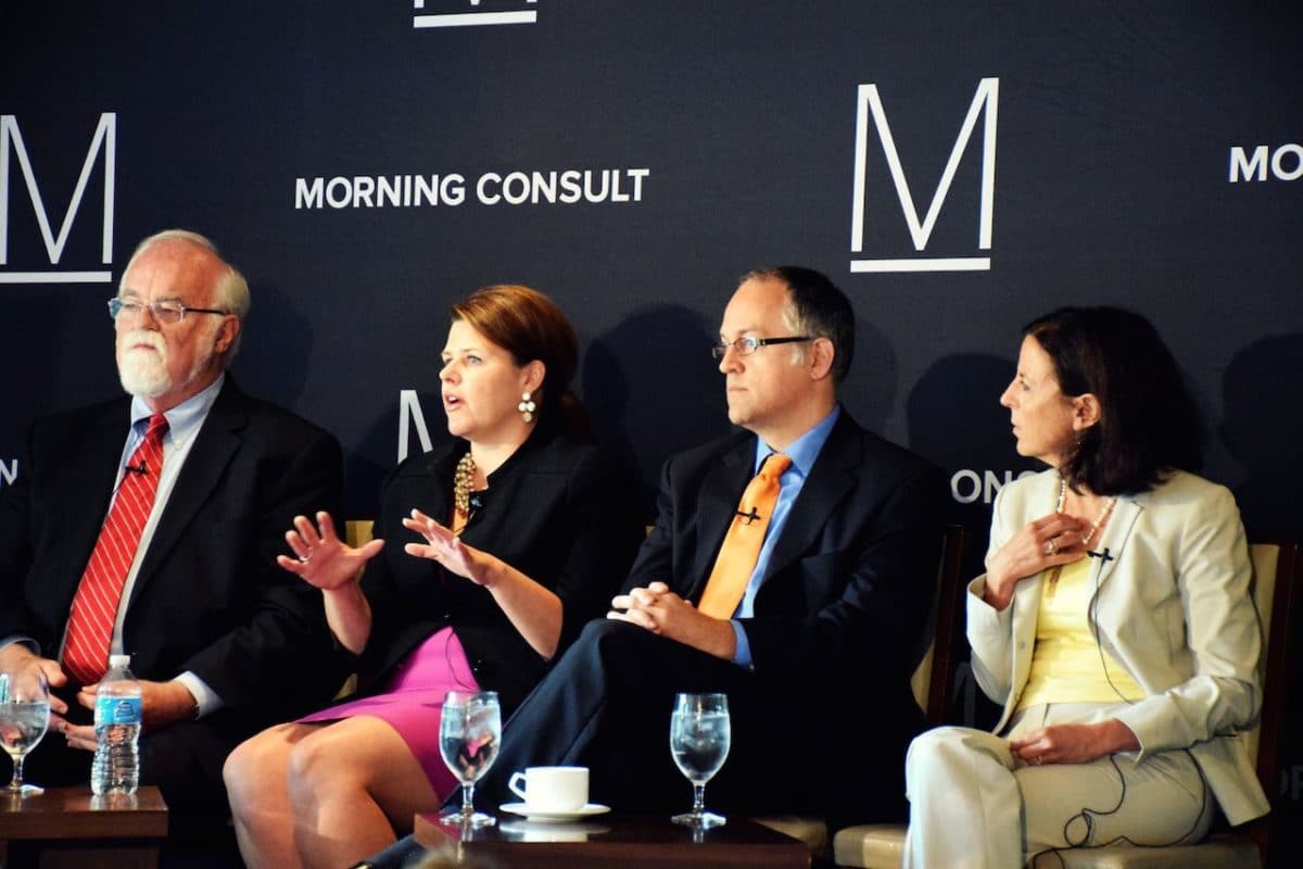 panel of four men and women with woman speaking