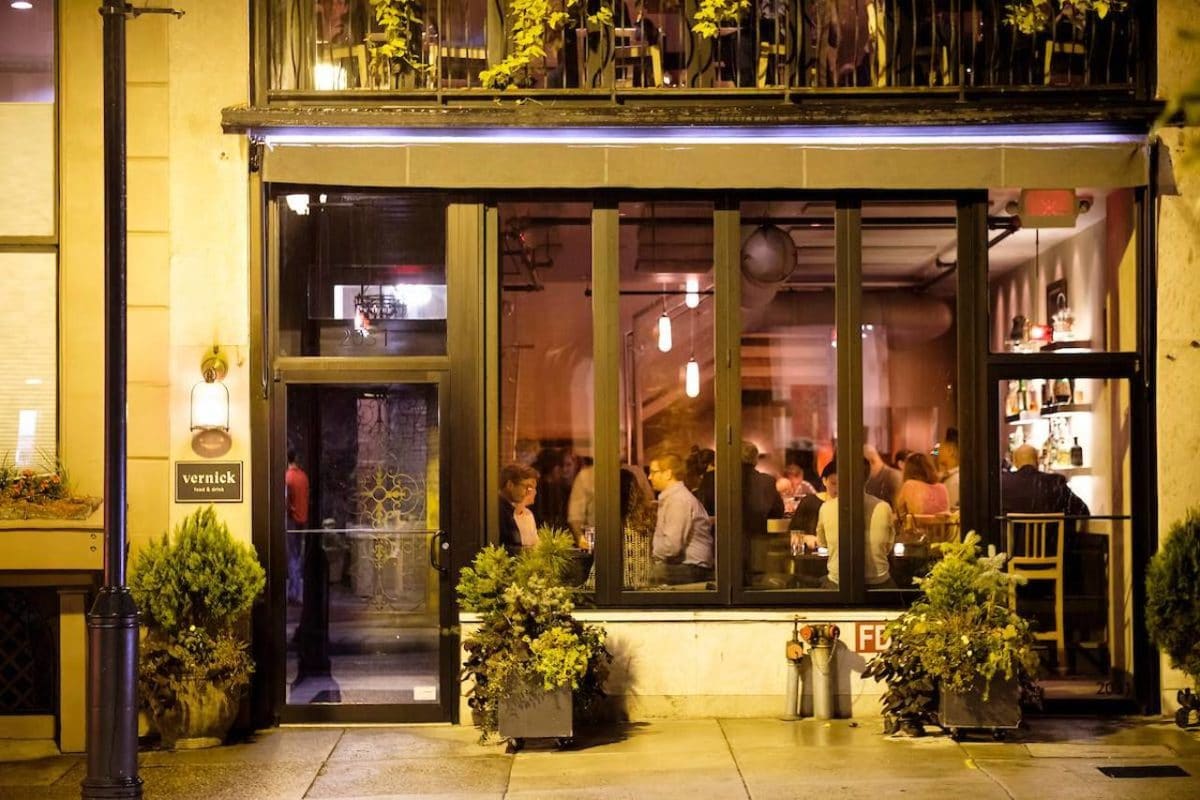 outside view of a restaurant with people eating at tables