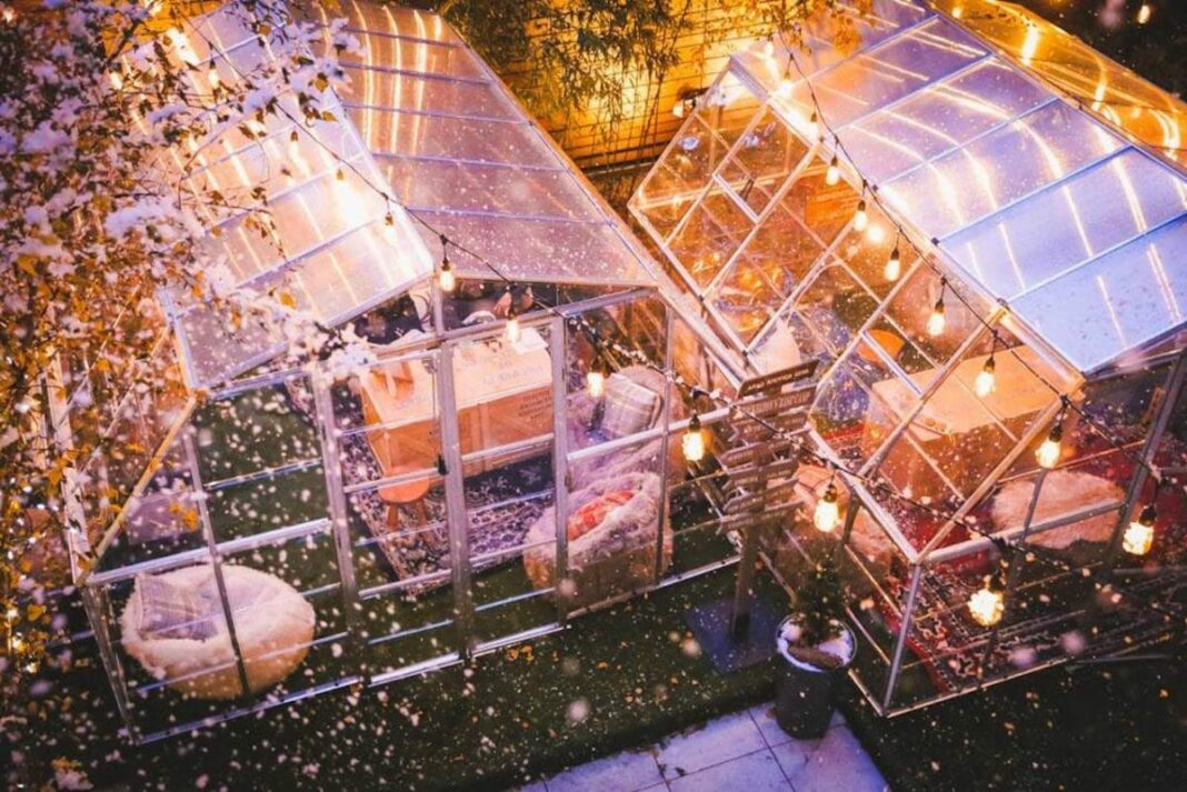 aerial view of winter rooftop bar in greenhouse