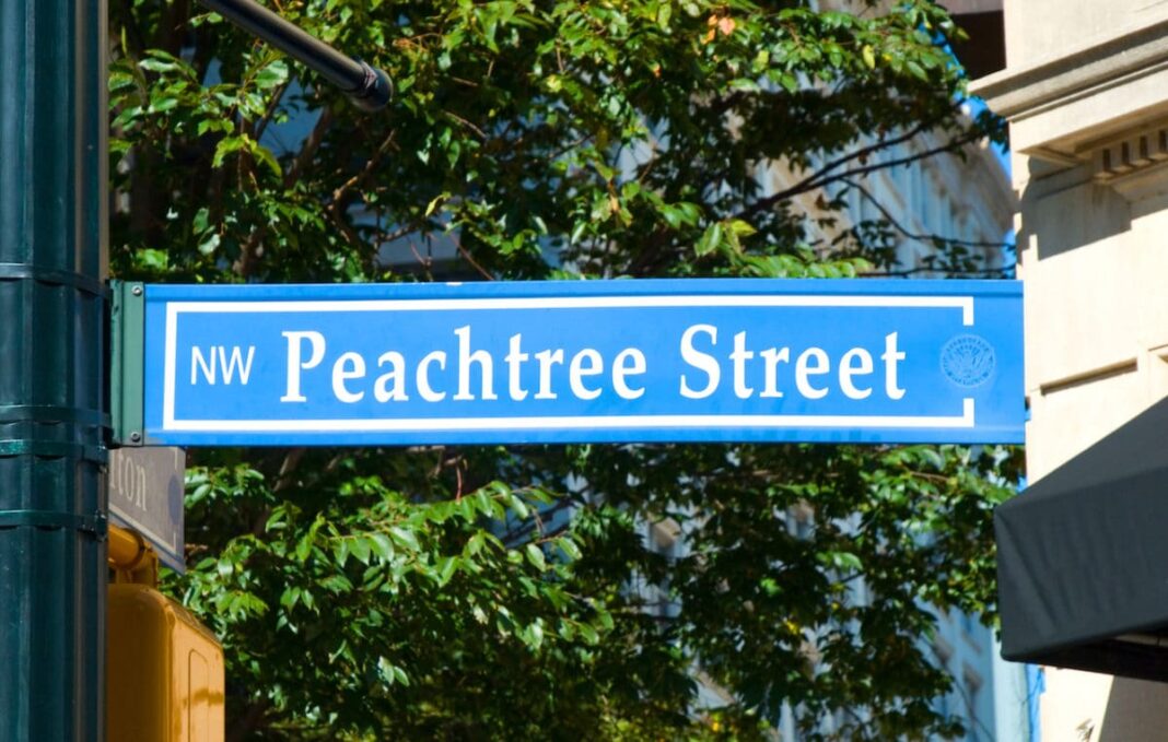 Blue street sign reading Peachtree Street