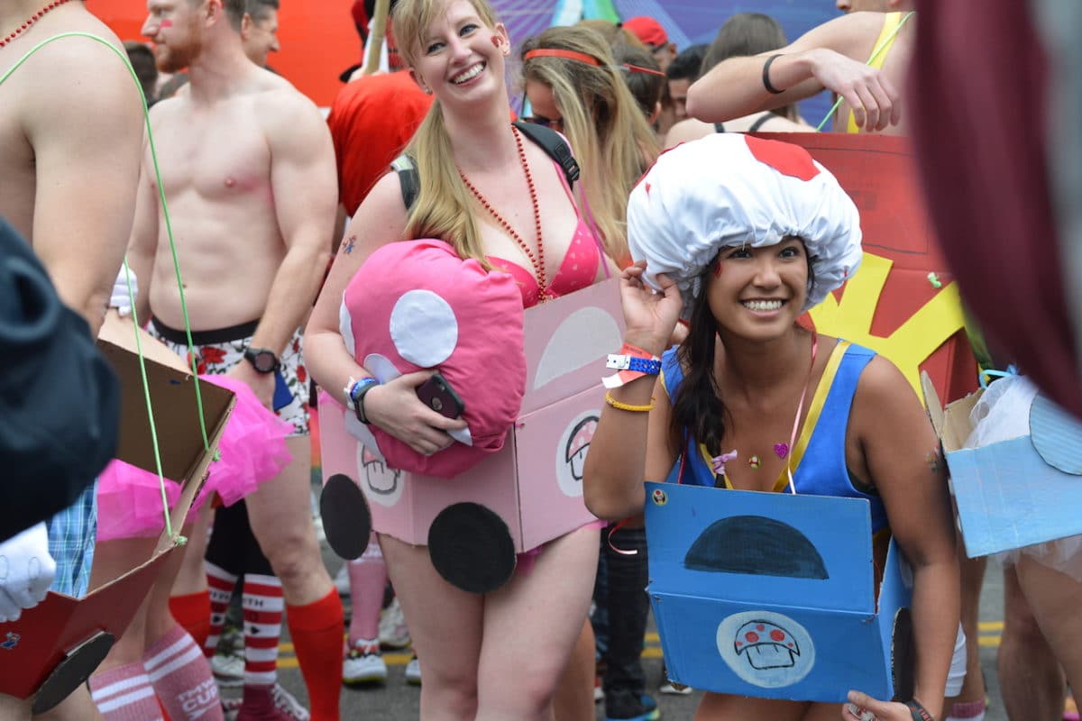 people in costumes and underwear during cupid's undie run