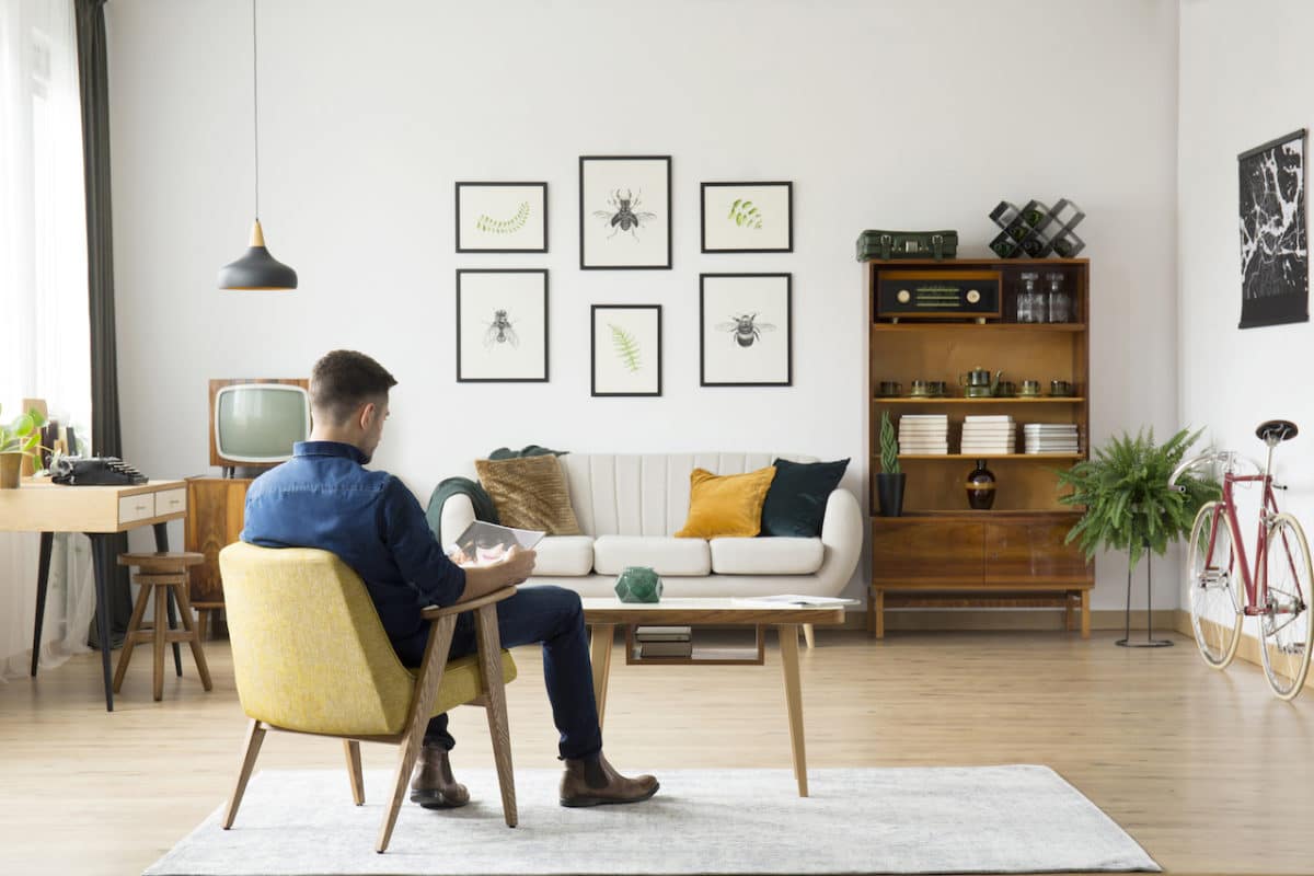 Man sitting in chair in tidy living room