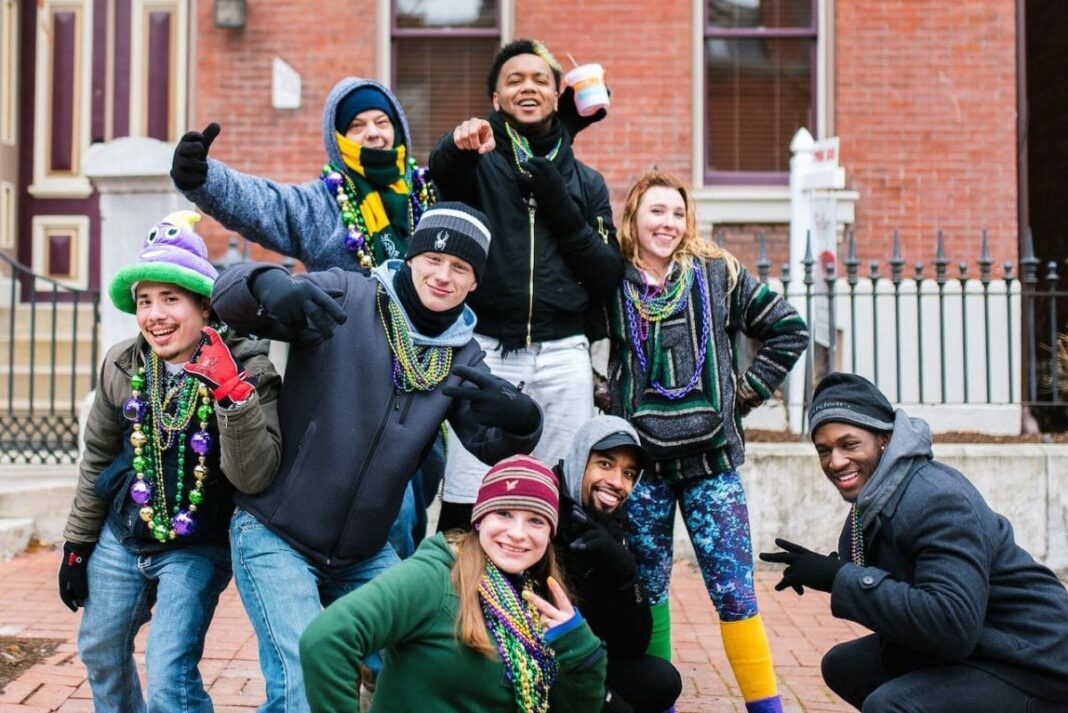 group of friends posing during mardi gras 