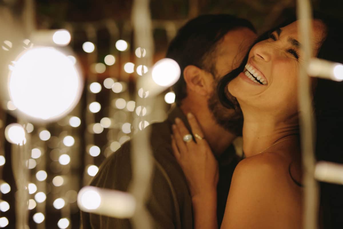 couple dancing under lights at night