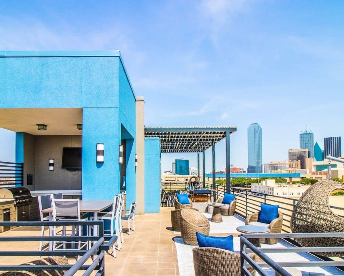 rooftop patio with view of city skyline