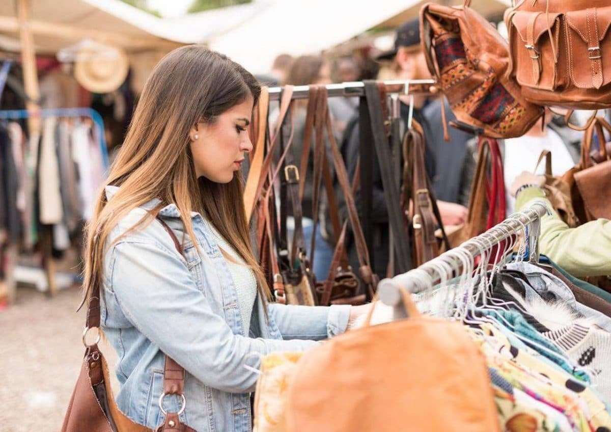 woman with brown hair shopping at outdoor market