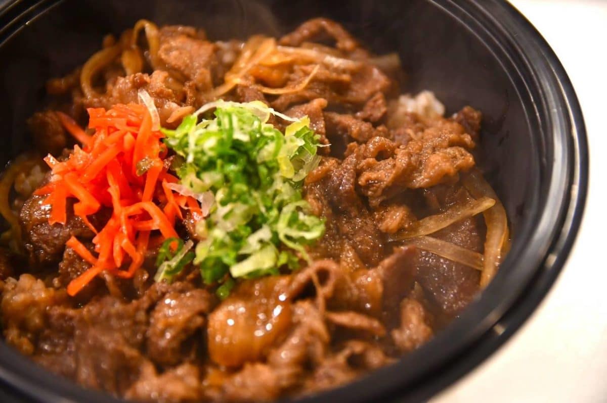 bowl with meat, cabbage, carrots, and rice