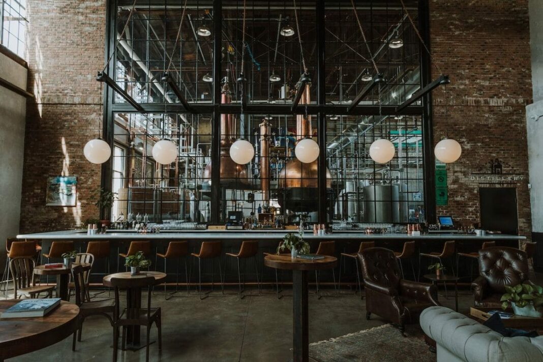 empty bar with windows behind it that look into Philadelphia Distilling