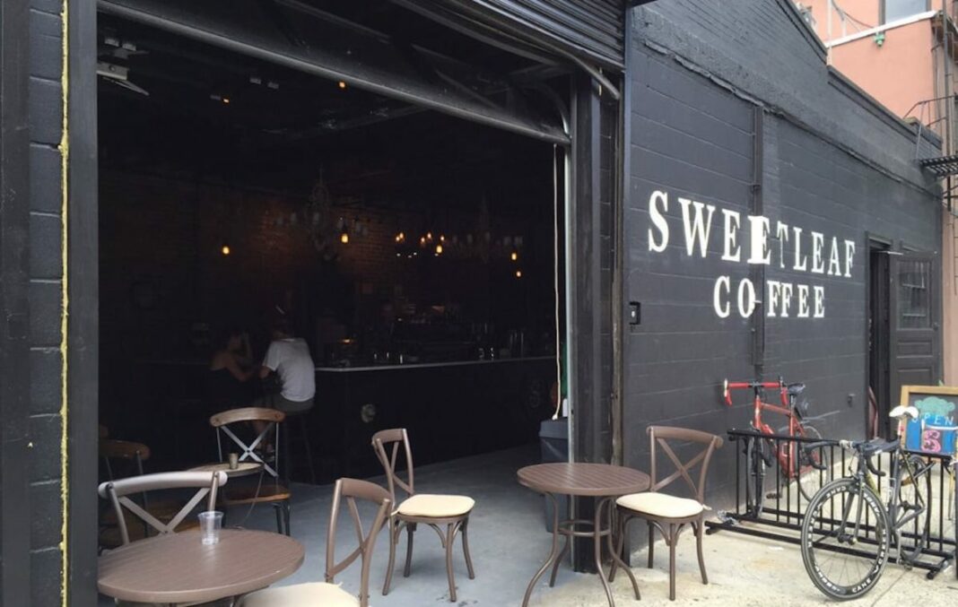exterior shot of sweetleaf coffee with its garage door open on sunny day