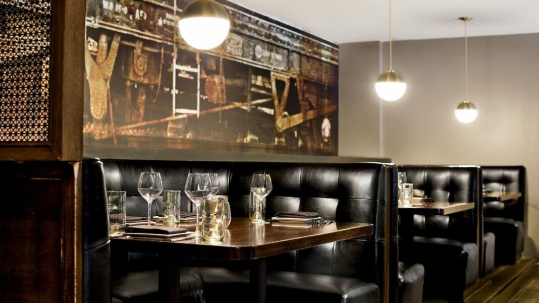 interior of nice bar and restaurant and a table with empty glasses on it