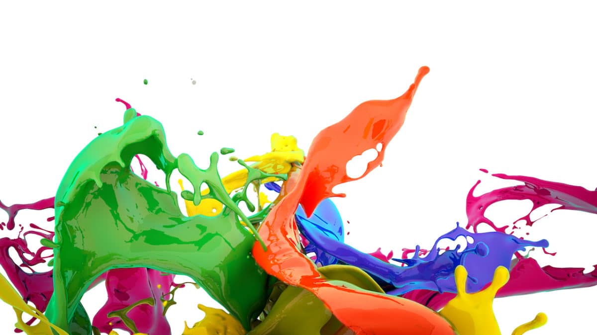 paint in amny different colors splashing against white background