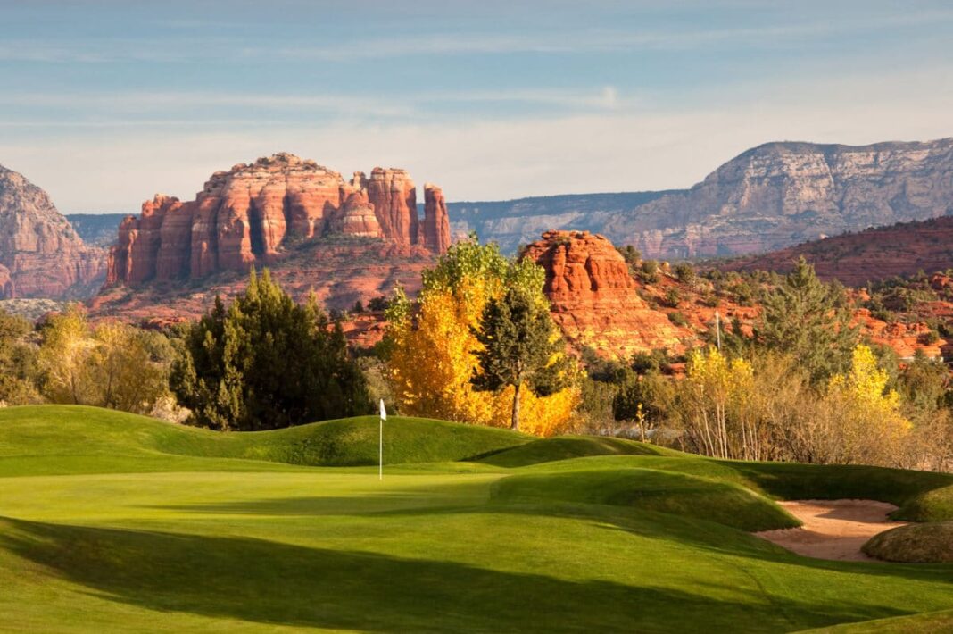 golf course with rock formation in background