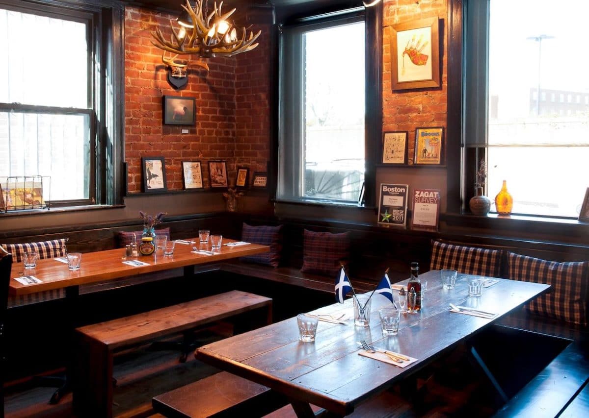 interior of scottish bar with wooded seats and tables