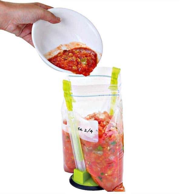 bag rack with person pouring salsa from bowl into it