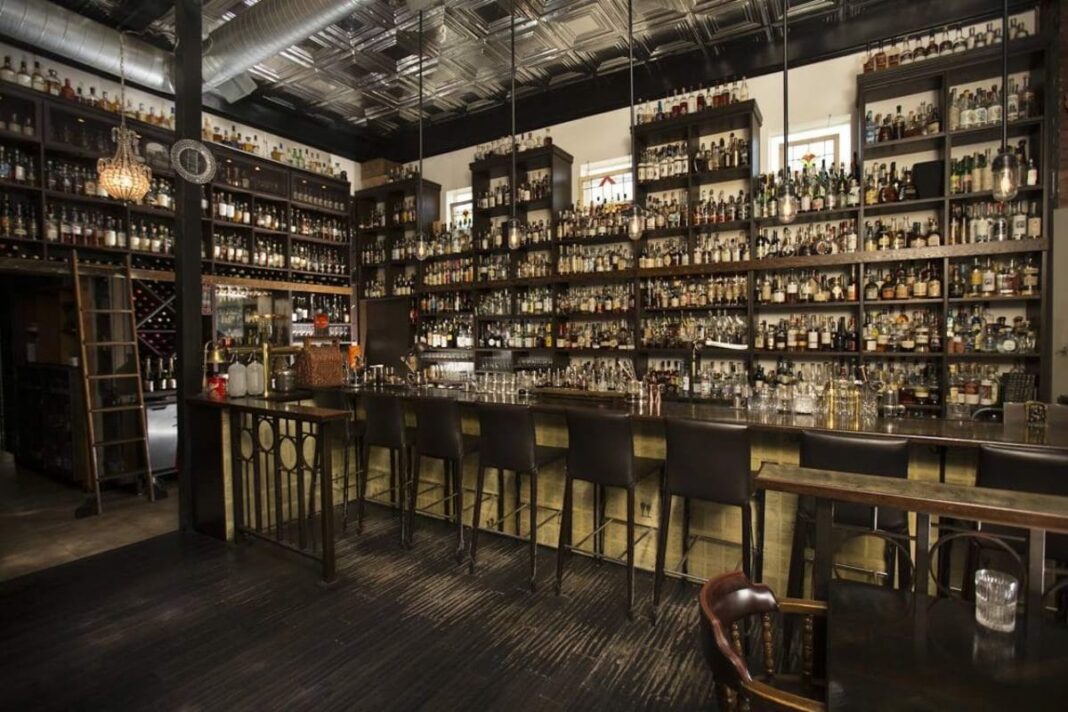 interior of bar with walls full of liquor