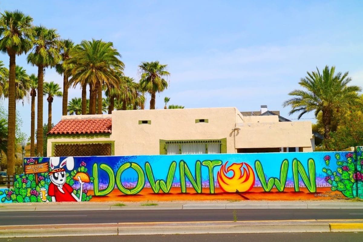 mural with cacti spelling out the word downtown