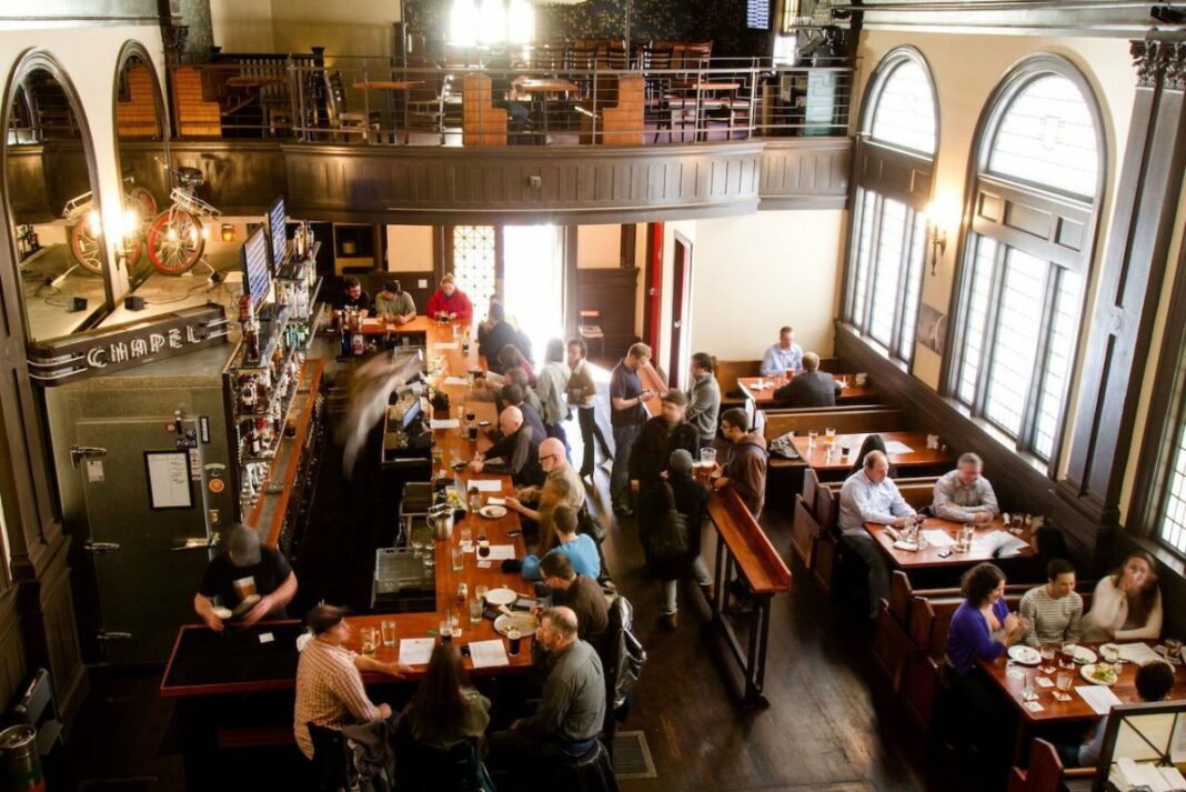 aerial view of bar downstairs with people eating an drinking