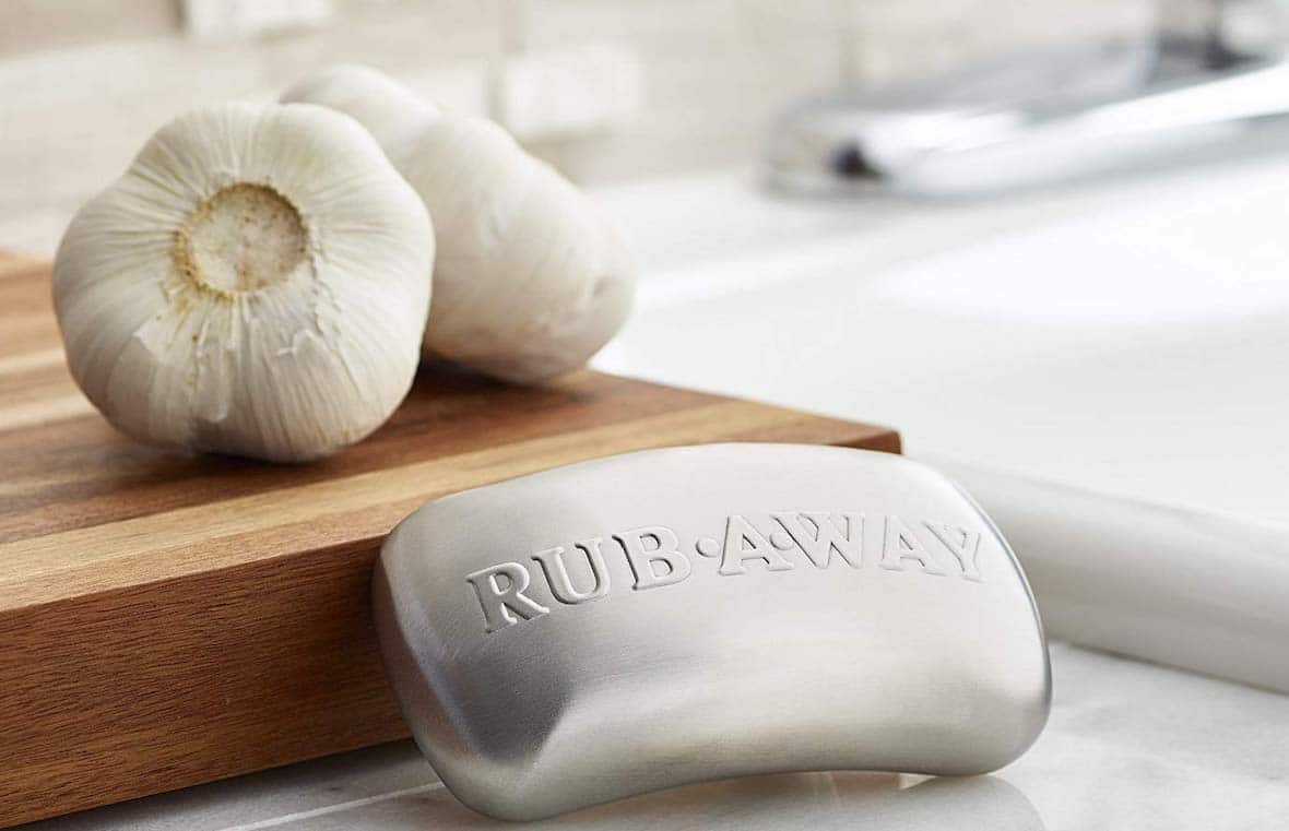 steel bar sitting on counter with garlic in the background