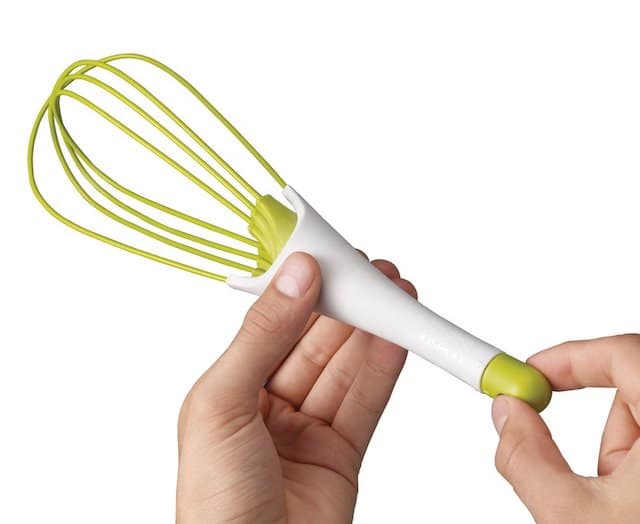 person twisting handle of whisk so it changes to spatula