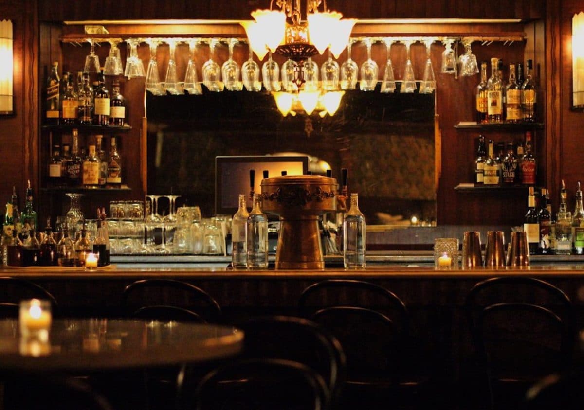 empty bar with dark lighting and speakeasy vibes