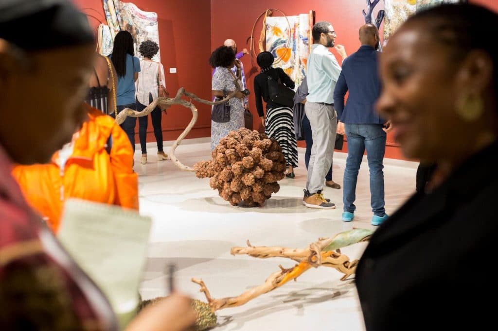 people strolling around museum