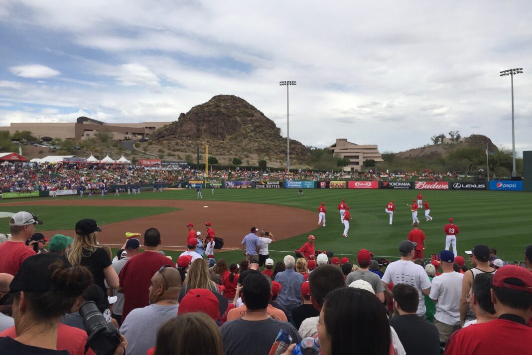 baseball field in arizona with players and fans in view