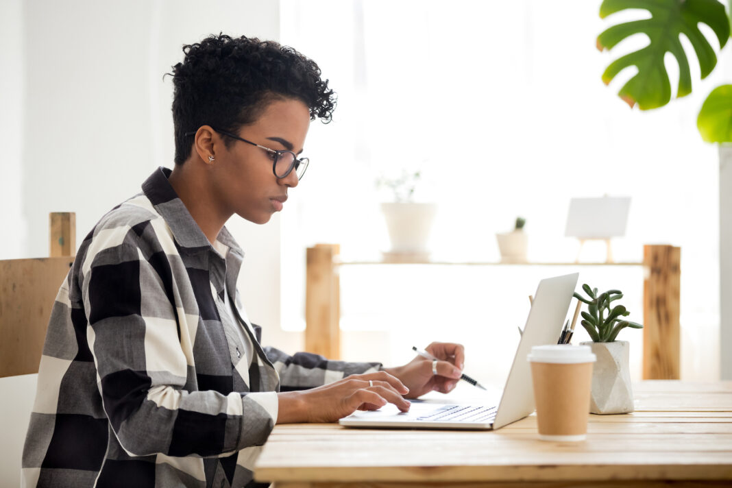 woman works on her laptop.