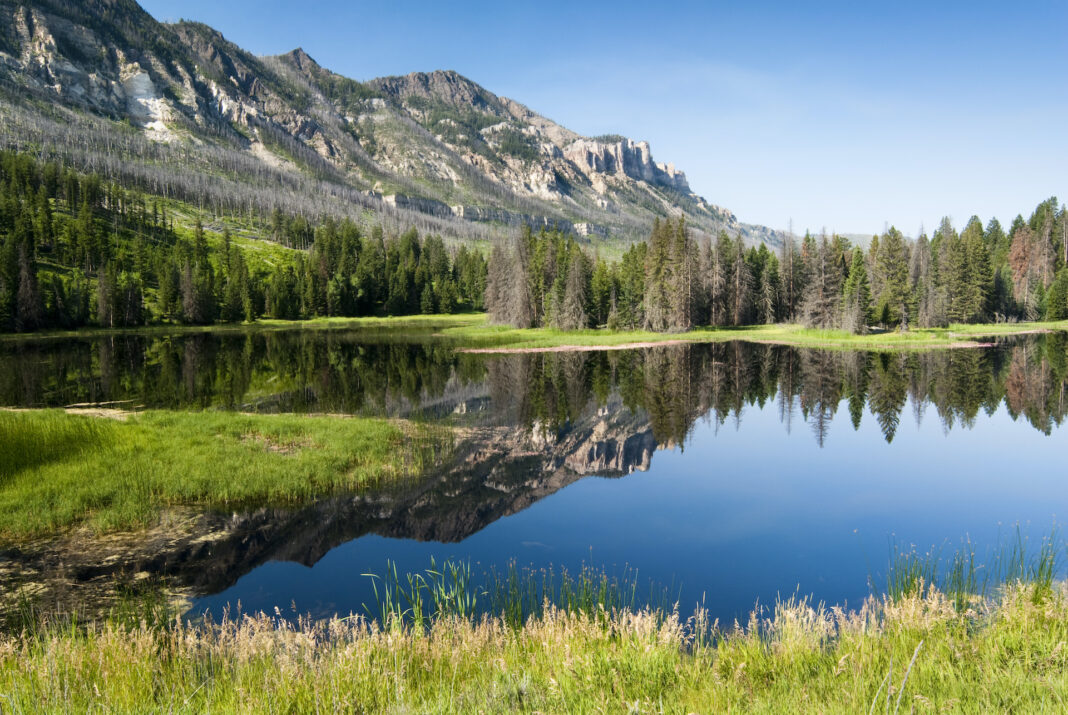 Scenic image of lake and mountains in Wyoming.
