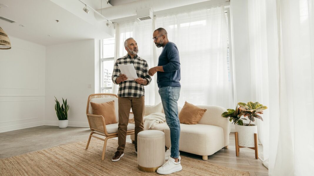 Senior man meeting health insurance broker or retirement plan agent for signature on agreement.