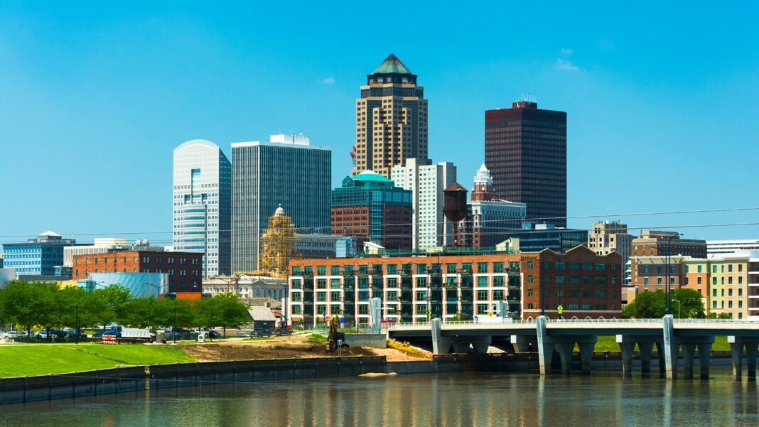 Des Moines downtown skyline with the Des Moines River in the foreground.