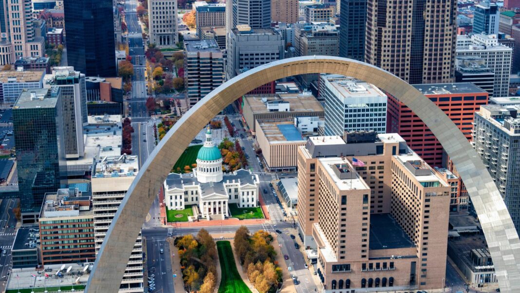 The Gateway to the West Arch and the downtown area of St. Louis, Missouri along the banks of the mighty Mississippi River shot from an altitude of about 700 feet over the river.