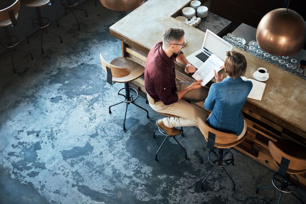 aerial view of two people talking at cafe