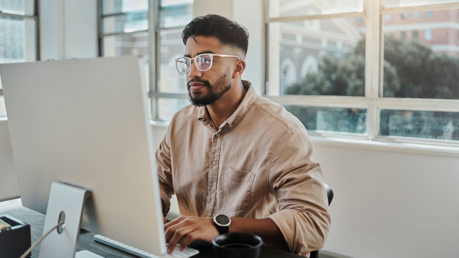 Young graphic designer with coding project or online company management